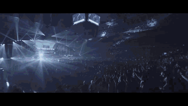 a man playing drums in front of a crowd