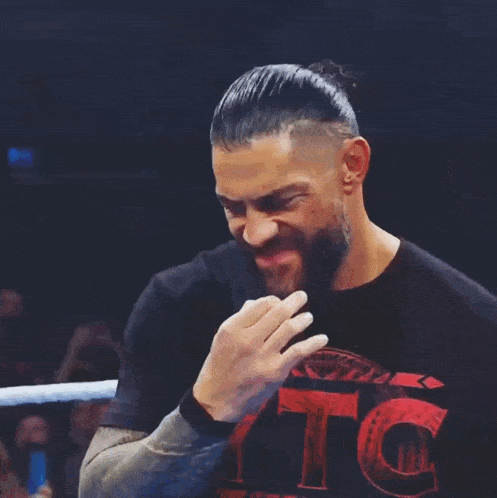 a man wearing a black t-shirt with the word ytc on it
