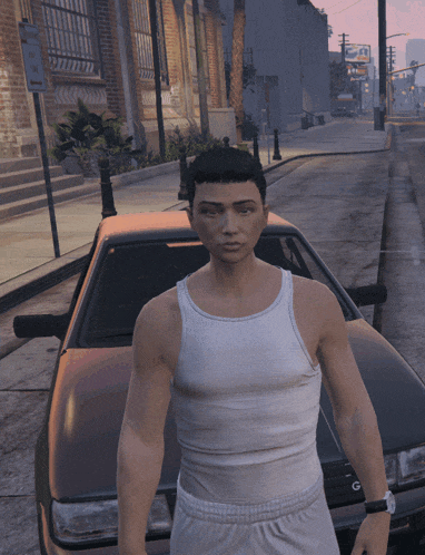 a man in a white tank top stands in front of a car that says gt on the front