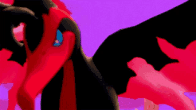 a close up of a red and black animal with a blue eye