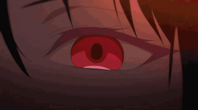 a close up of a person 's eye with a red swirl around it