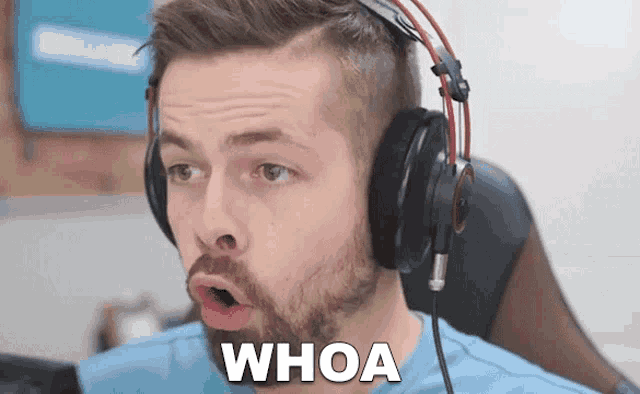 a man wearing headphones with the word whoa written on his face