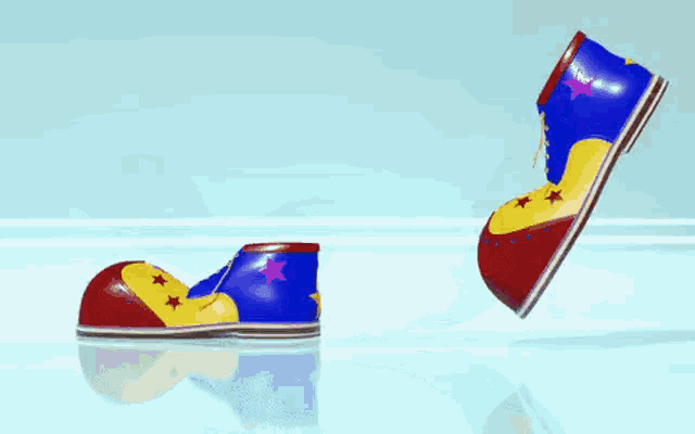 a pair of clown shoes with stars on them
