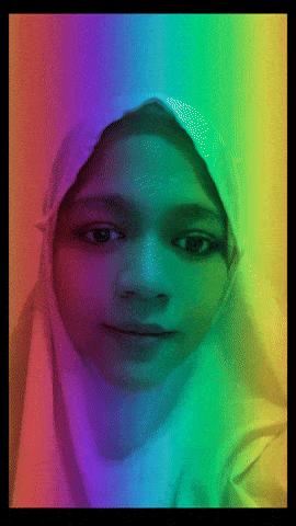 a girl wearing a white hijab with a rainbow colored background