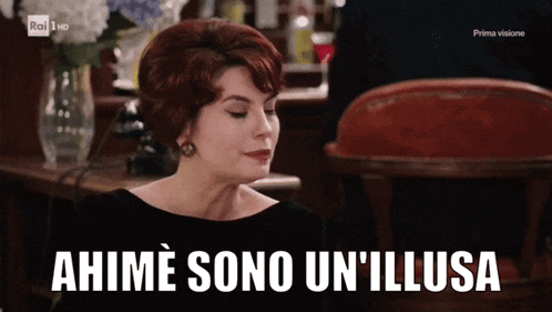 a woman in a black dress says " ahime sono un'illusa " in a foreign language
