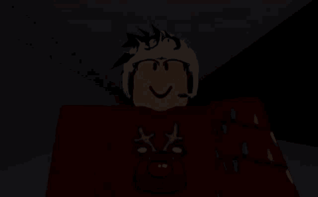 a person in a red sweater with reindeer on it