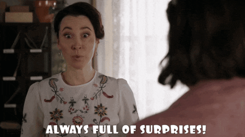a woman says " always full of surprises " in front of a man