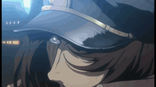 a close up of a person wearing a hat with a gold trim
