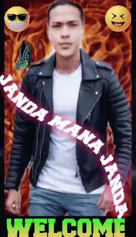 a man in a leather jacket stands in front of flames and a welcome message