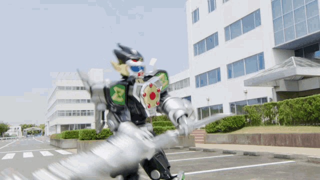 a robot with a sword and shield in front of a large building