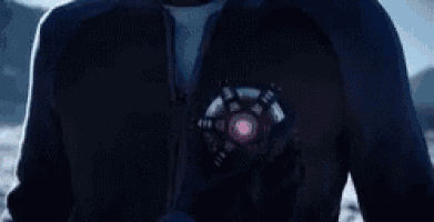 a man is holding a steering wheel in his hand .