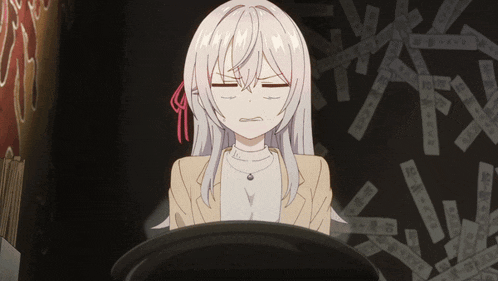 a girl with white hair is sitting in front of a sign that says ' a ' on it