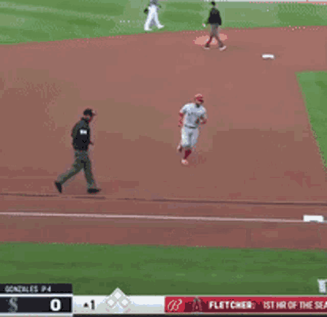 two baseball players on a field with a scoreboard that says fletcher on it