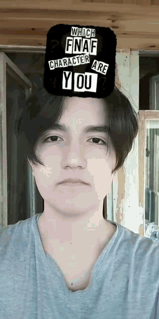 a young man with a which fnaf character are you sticker on his head