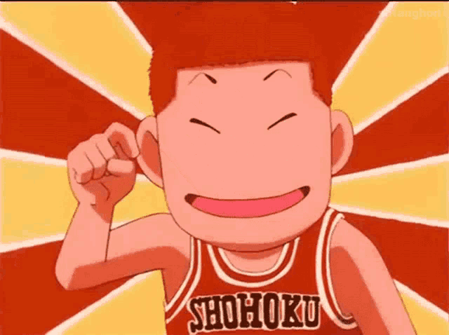 a cartoon character wearing a shohoku basketball jersey is smiling .
