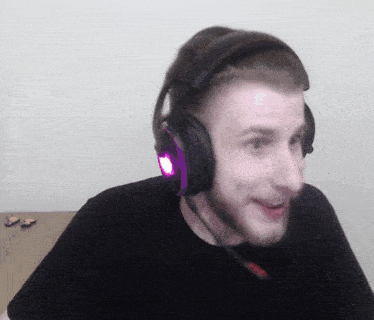 a man wearing a pair of headphones with purple lights on them