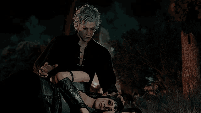 a man is standing next to a woman who is laying down