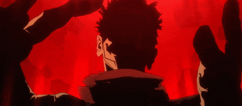 a man 's head is being held by a red background