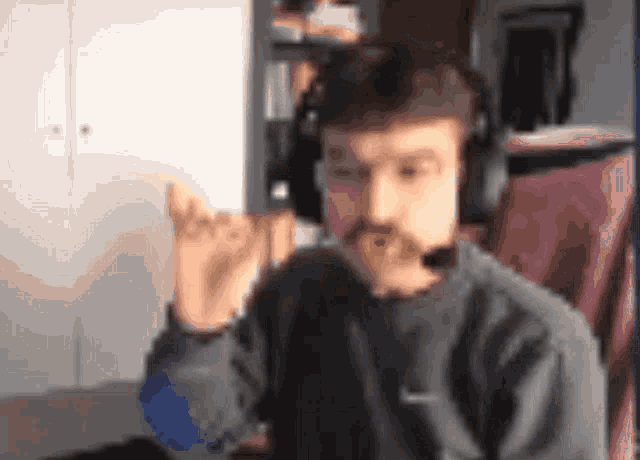 a blurry picture of a man wearing headphones