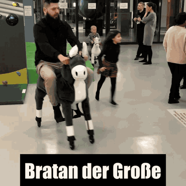 a man is riding a stuffed donkey with the words bratan der große above him