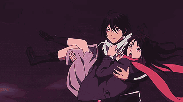 a man is holding a girl in his arms and the girl is looking surprised