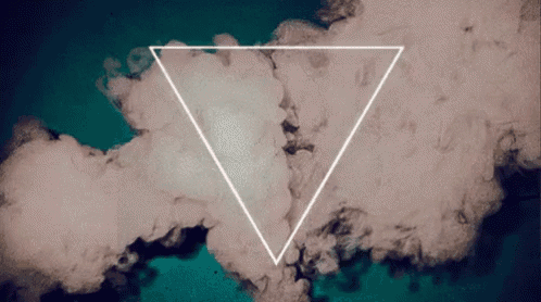 a white triangle is surrounded by smoke on a dark background