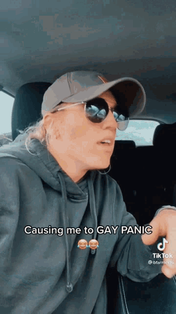 a woman wearing sunglasses and a hat says " causing me to gay panic " on a tiktok video