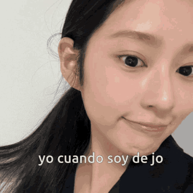 a close up of a woman 's face with yo cuando soy de jo written on the bottom