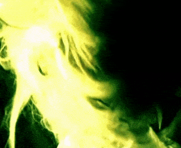 a close up of a person 's face with a yellow background .