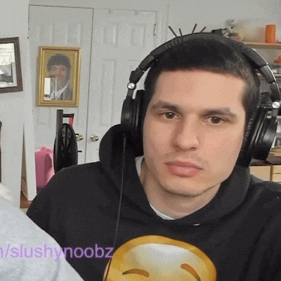 a man wearing headphones and a hoodie that says slushynooz