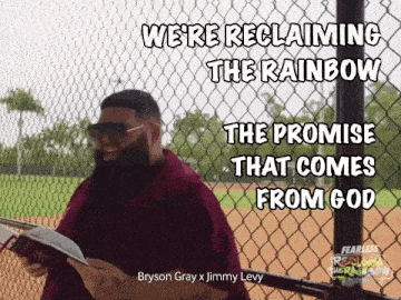 a man with a beard is holding a book and says " we 're reclaiming the rainbow "