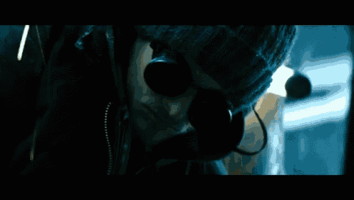 a close up of a man wearing goggles and a helmet
