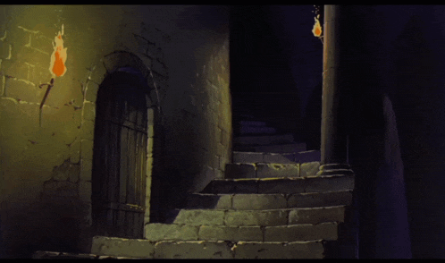 a staircase in a dark room with a door