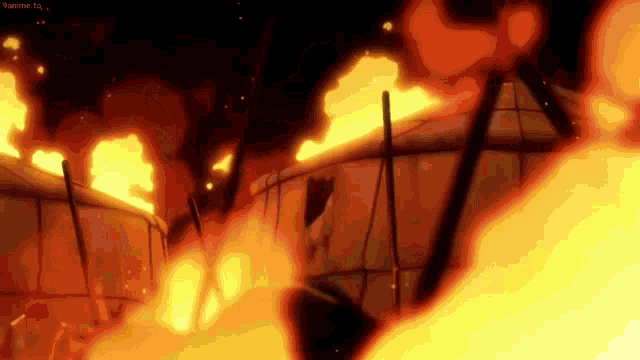 a group of tents are burning in a fire in a dark room .
