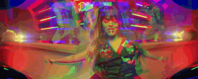 a woman in a colorful dress is dancing in front of a neon sign that says mcdonald 's