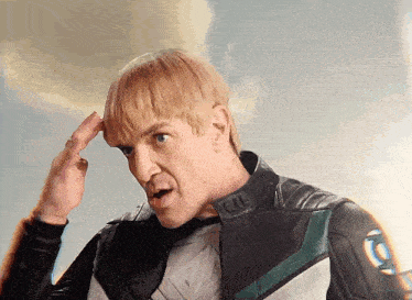 a man in a superhero costume with the letter l on his chest