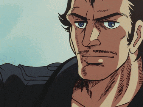 a close up of a man 's face with a blue eye