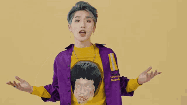 a young man wearing a purple jacket and a yellow shirt that says let 's go napoli on it