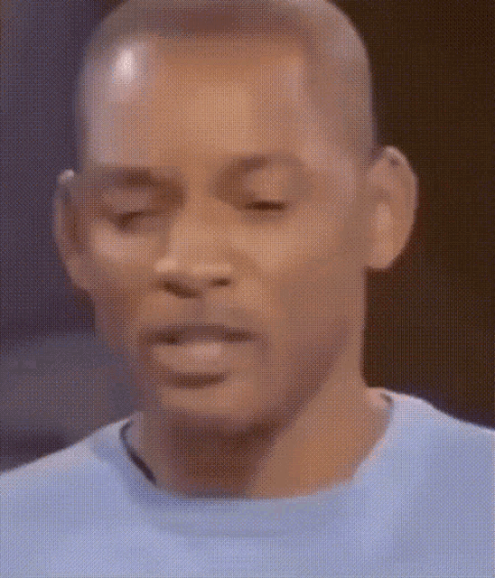 a close up of a man with his eyes closed