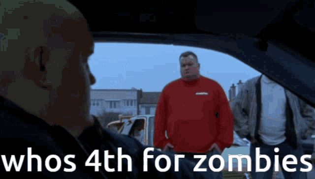 a man in a red shirt is talking to another man in a car with the words whos 4th for zombies on the bottom