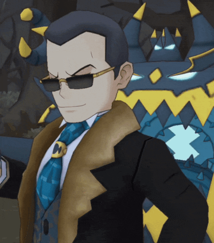 a man in a suit and tie is standing in front of a blue monster