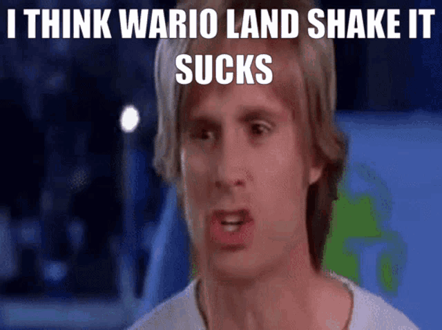 a man making a funny face with the words i think wario land shake it sucks above him