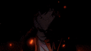 a blurry picture of a person standing in front of a flame