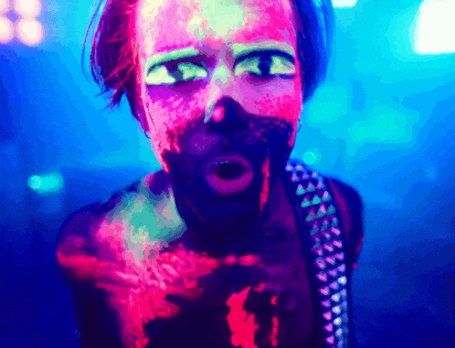 a man with glow in the dark makeup on his face