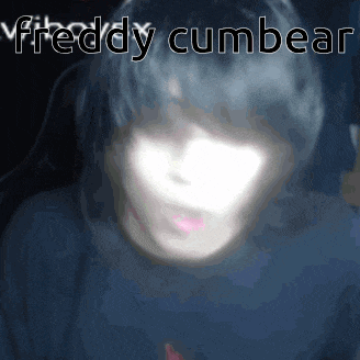 a blurry picture of a person with the words freddy cumbear written on the bottom