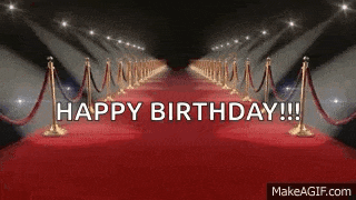 there is a red carpet with the words `` happy birthday '' written on it .