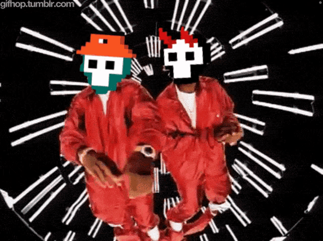 two men in red jumpsuits are dancing in front of a clock with the website gifhop.tumblr.com on the bottom