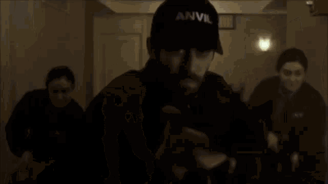 a person is walking down a hallway with smoke coming out of the ceiling .