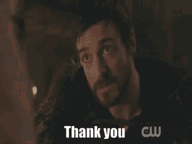 a man with a beard is looking up and saying thank you .