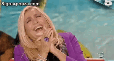 a woman in a purple jacket is laughing with the website signorponza.com in the background